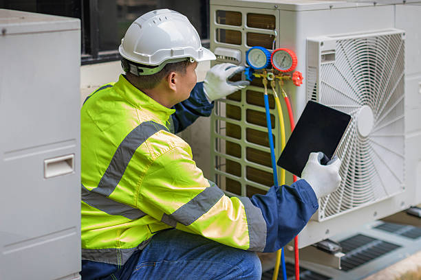 Professional Air Duct Cleaning technician working in Redwood City, CA